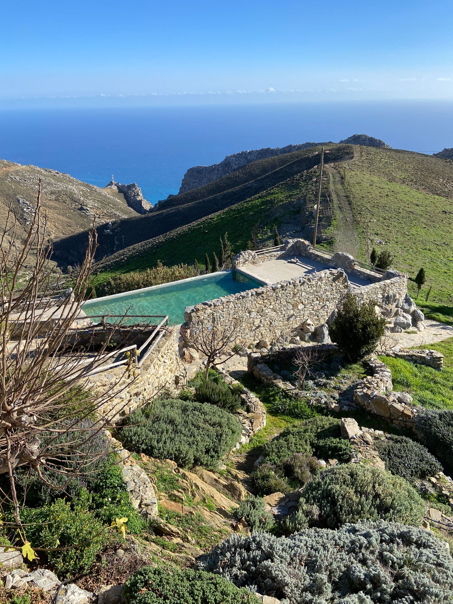 A Slow Cyclist villa and swimming pool overlooking the Cretan coastline.