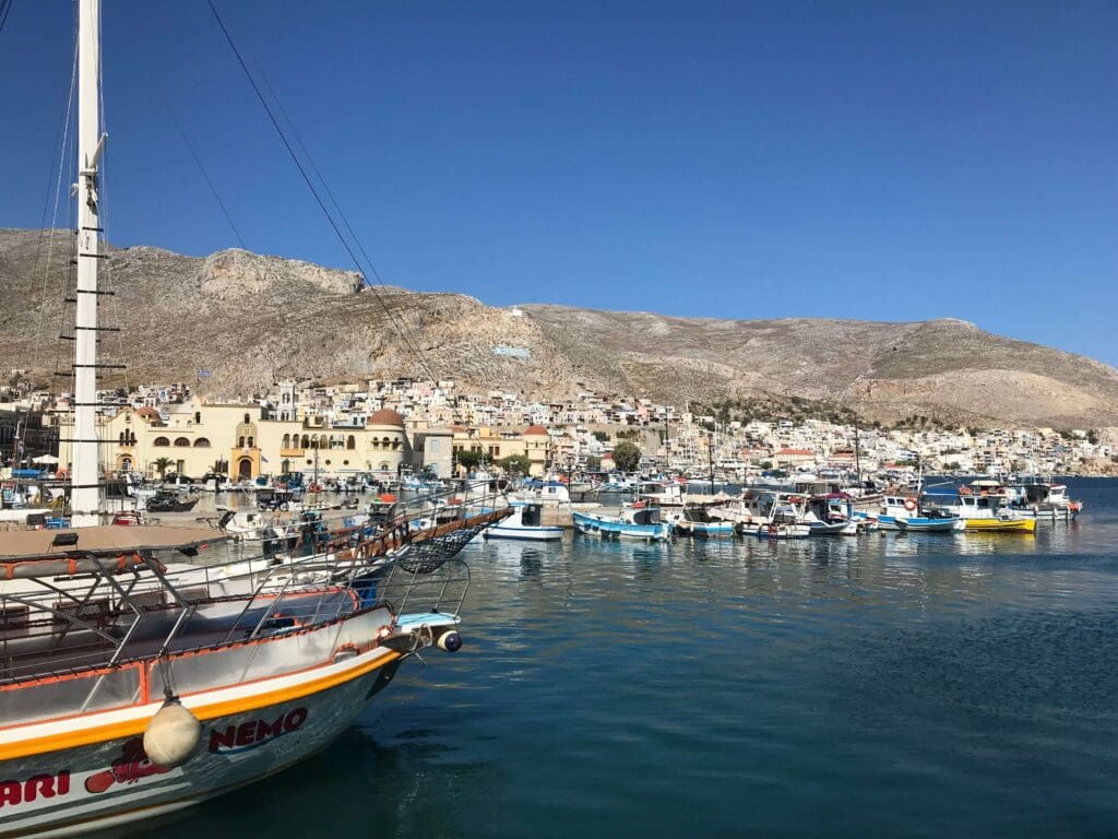 The Slow Cyclist route through the Greek Islands stops at a fishing port in the Dodecanese Islands, Greece.