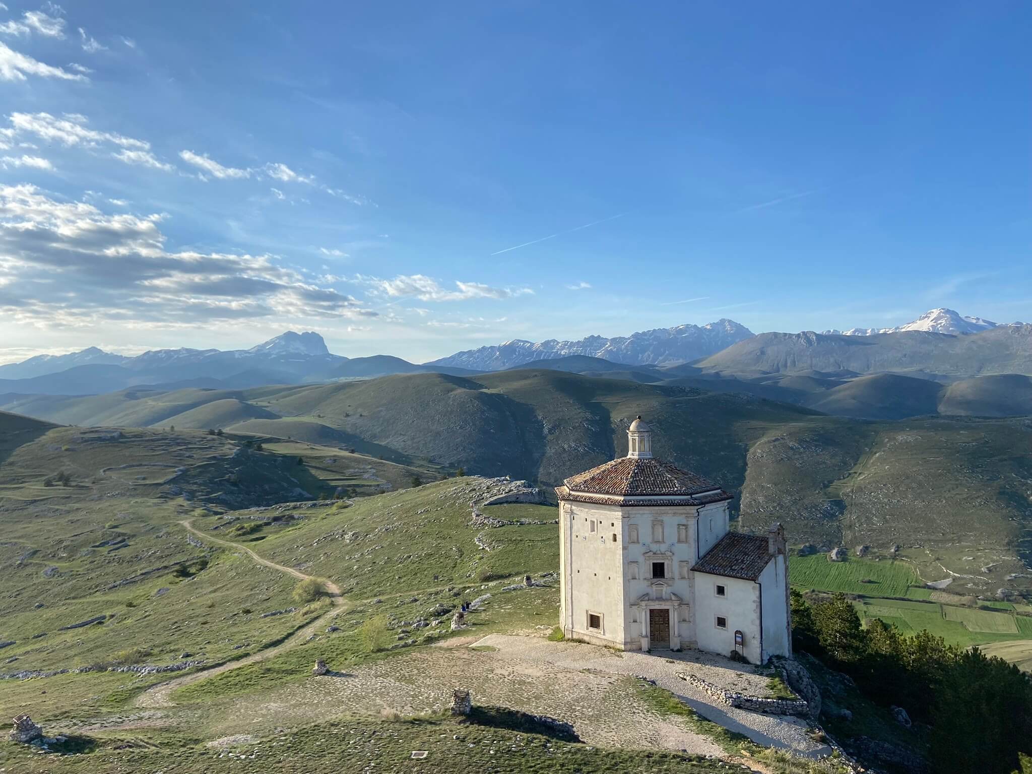 A stone chapel visited by Slow Cyclists, in the hills of the Abruzzo Mountains, Italy.