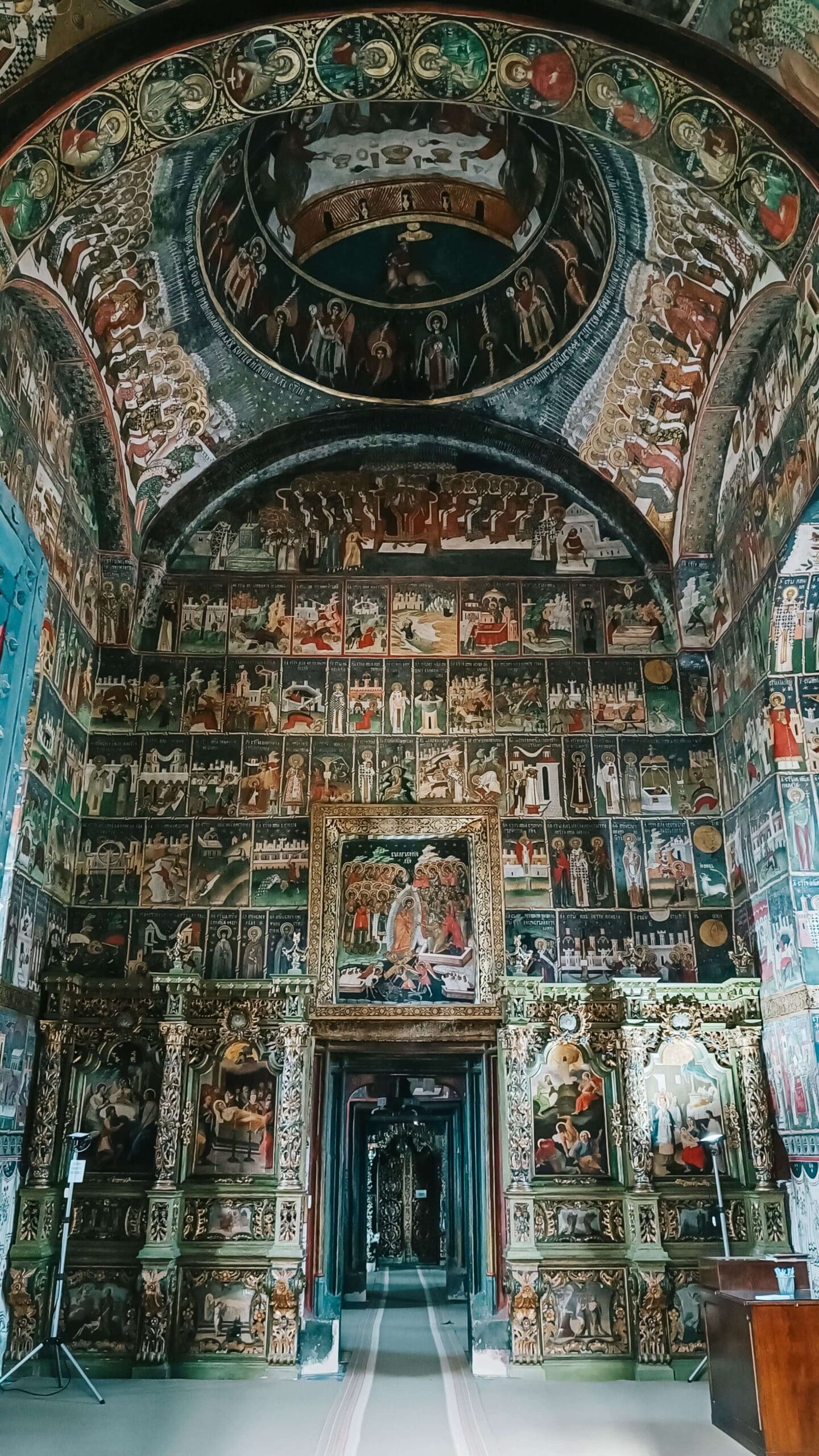 The interior of a painted church in Bucovina, as seen on Romania's Via Transilvanica by Slow Cyclists