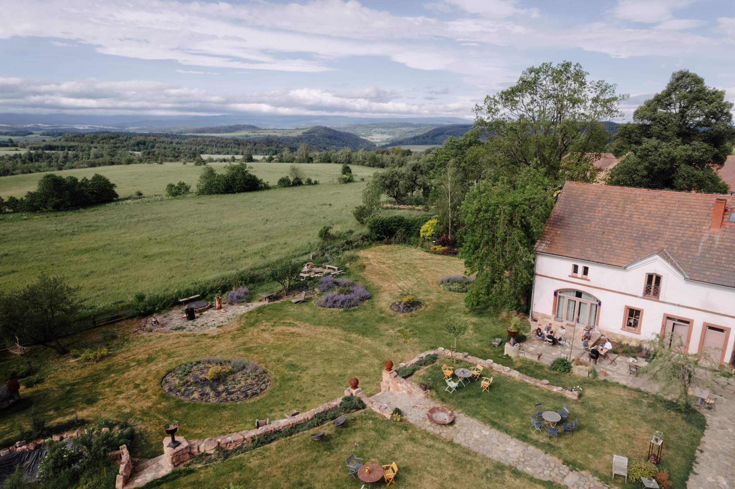 An aerial view of a traditional Lower Silesian guest house and the countryside beyond on a Slow Cyclist journey through Poland.