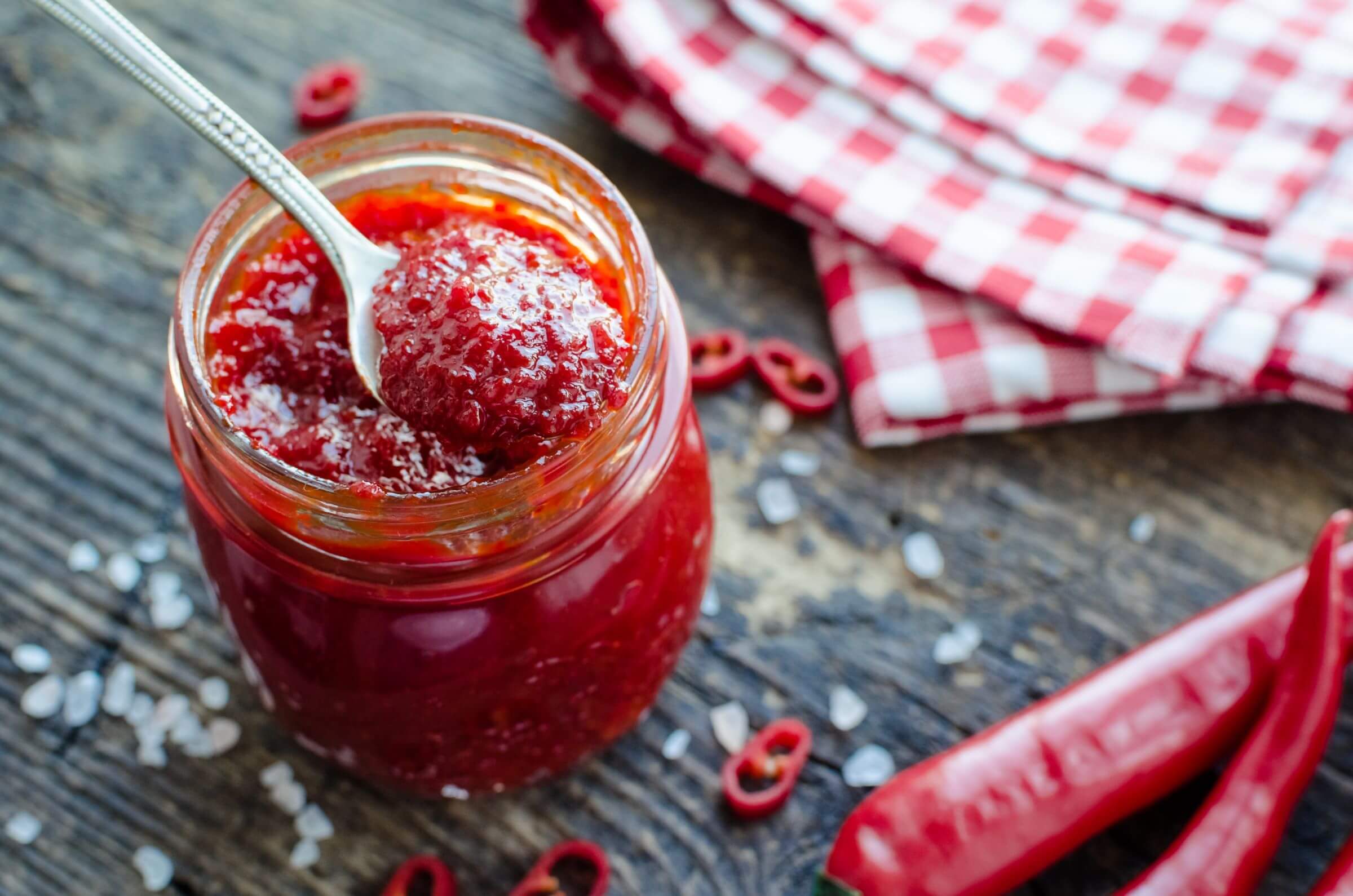 A jar of chilli jam, like the one Anca makes in her Transylvanian home visited by Slow Cyclists.