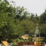Cider and cordial on a tray ready for Slow Cyclist guests in a guest house garden in Lower Silesia, Poland.