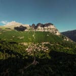 A view of mountains and traditional stone villages in Zagori, Greece.