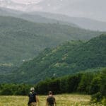 Two Slow Cyclists walking in the wildflowers and mountains of the Armenian Highlands