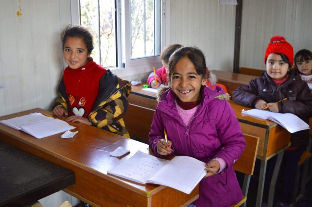 Children in a school classroom in Syria, one of the education projects that Action Syria has helped fund