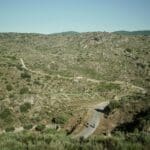 Two Slow Cyclists riding on winding roads in the Douro Valley, Portugal.